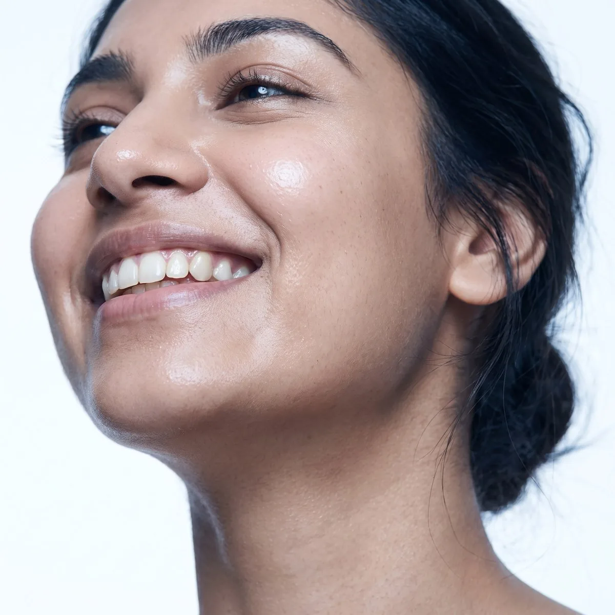 A BHRC provider assessing chin profile and fat thickness