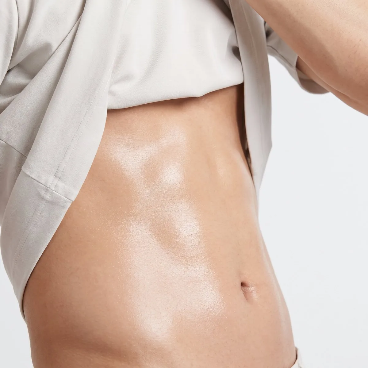 Close-up of a flat well-healed lower abdominal scar after treatment at BHRC