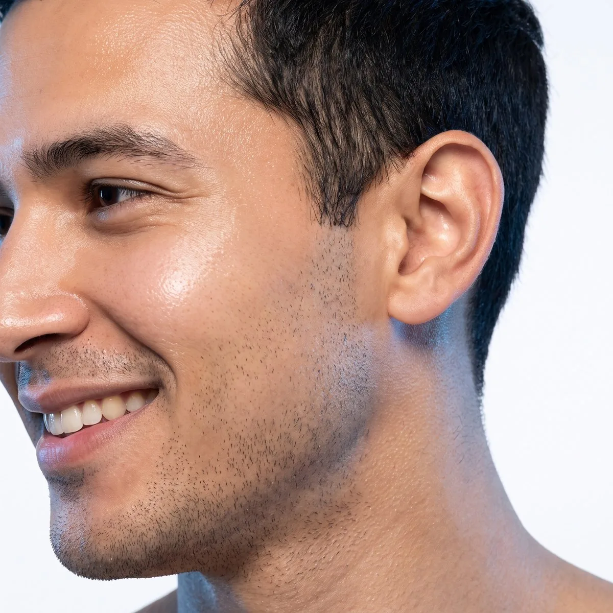 Close-up of smooth even skin behind the ear after keloid treatment at BHRC