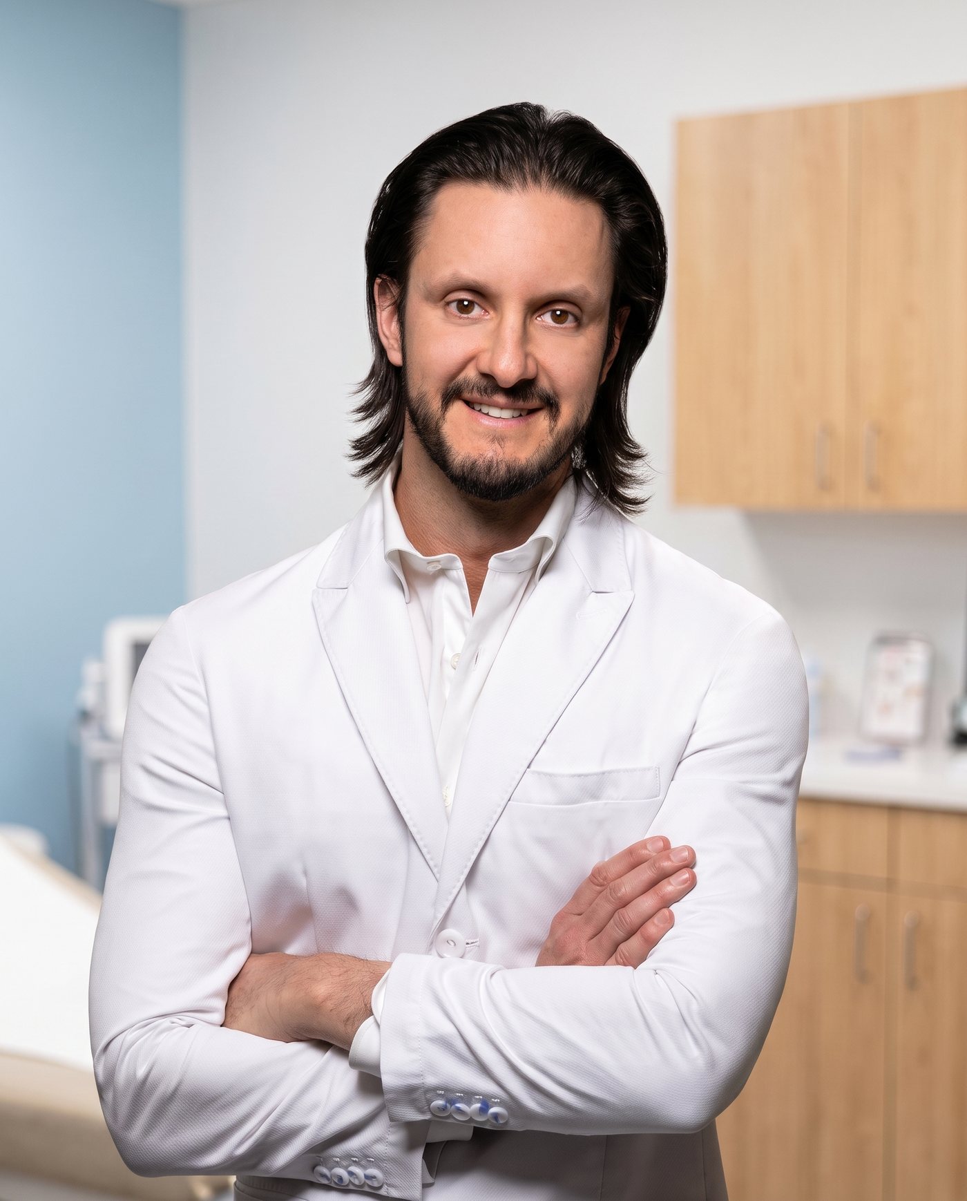 Dr. Dusan Sajic, MD, PhD, FRCPC, dermatologist, in a treatment room at BHRC West Hollywood