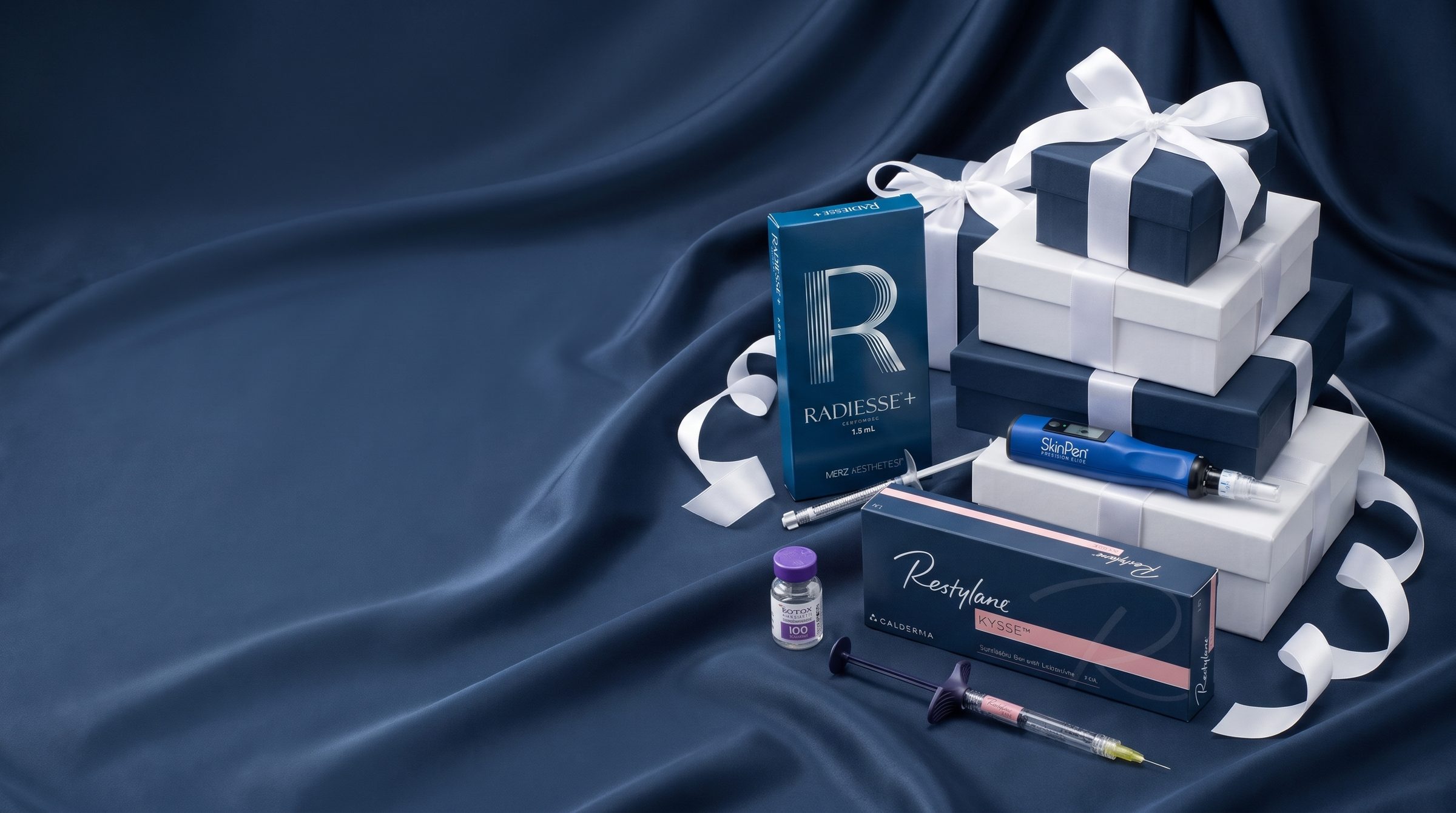 Radiesse, Restylane Kysse, Botox and SkinPen with BHRC gift boxes on navy satin